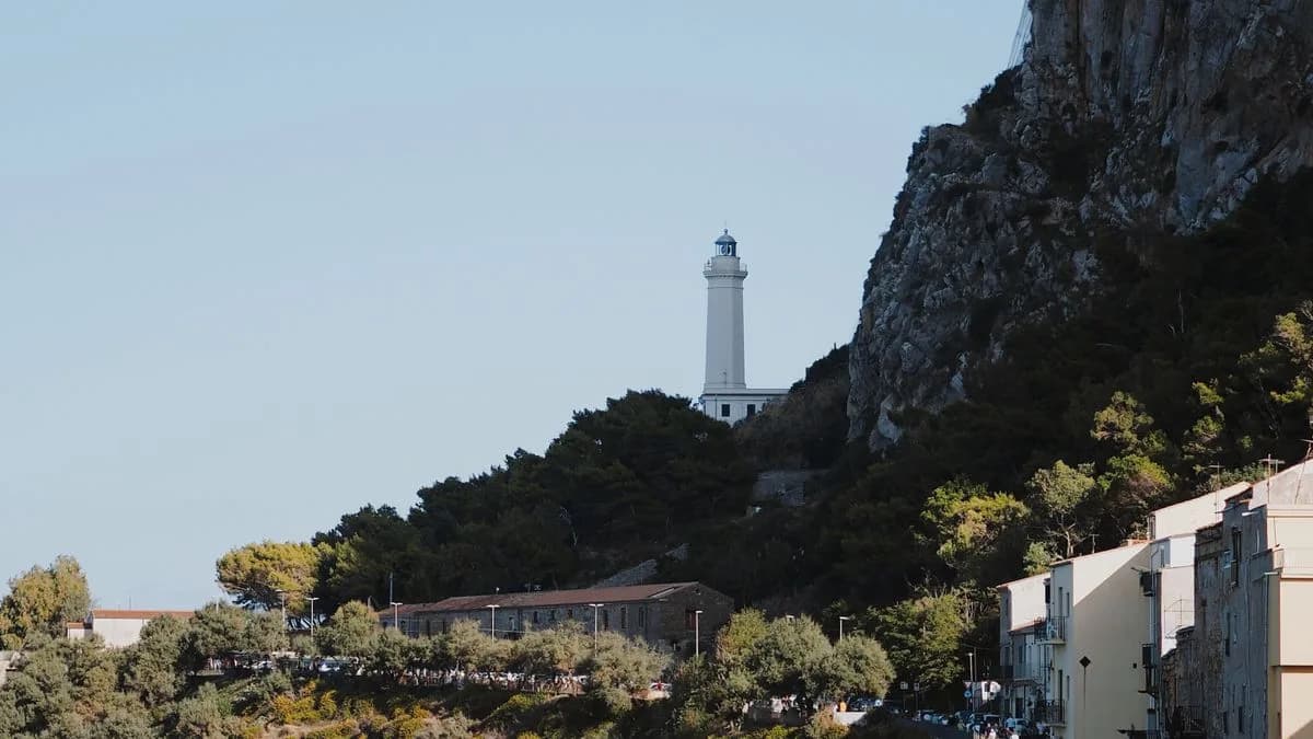 Transferhood — Trapani: Erice, Segesta and the Salt Coast (a lighthouse on the rocky Sicilian coast)